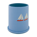 Blue textured cup with sailboat design on a white background
