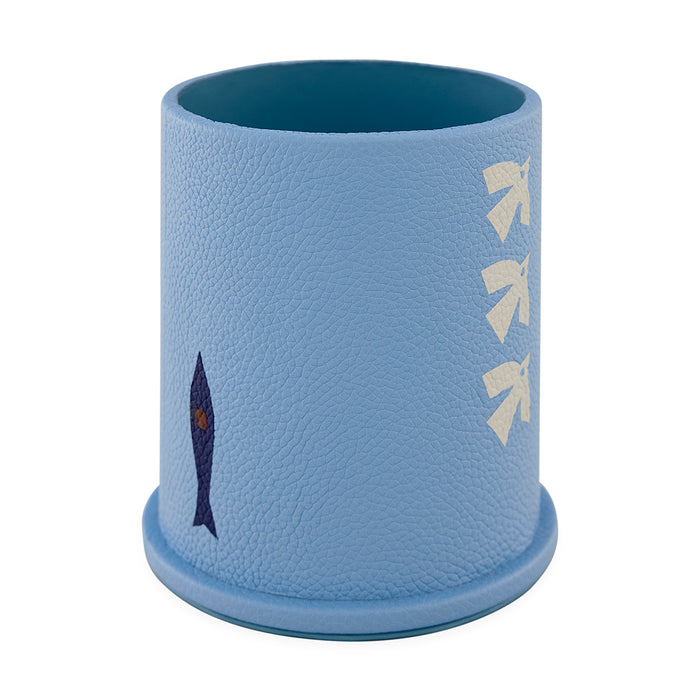 Blue textured cup with fish design on a white background