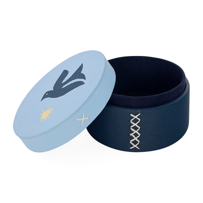 Navy blue and light blue circular containers with decorative elements on a white background