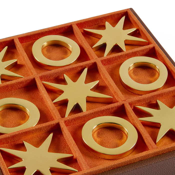 Decorative items with gold rings and star shapes on a red background