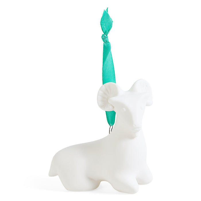 A white ceramic ram ornament with a mint green ribbon hanger, shown on a clean white background.