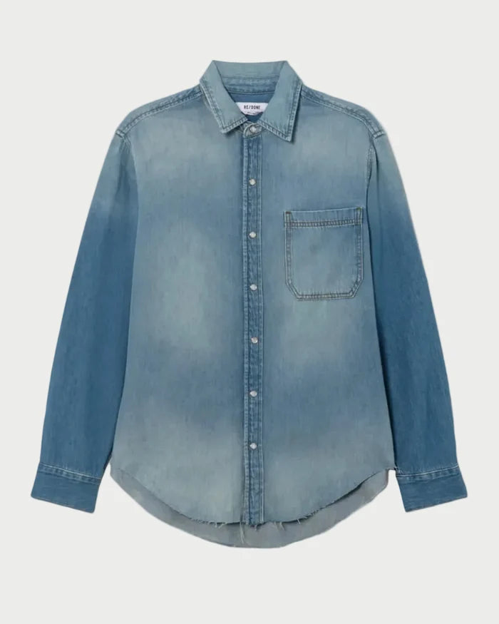 Blue denim shirt on a light gray background