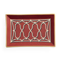 A rectangular ceramic serving tray with a deep red interior, featuring a cream-colored geometric lattice pattern in the center and a thin gold rim.