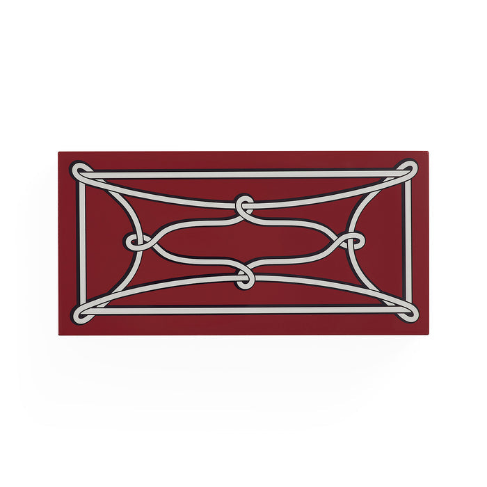 A rectangular decorative wall plaque featuring a white rope or cord wrapped in a geometric knot pattern over a deep burgundy background, shown against a plain white studio backdrop.