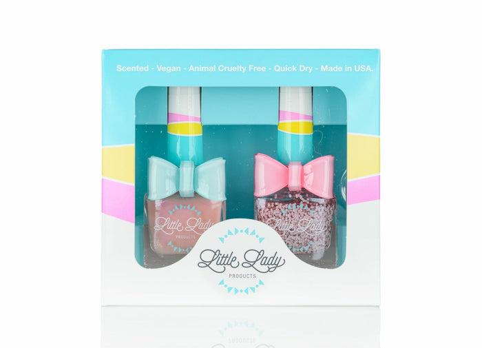 Rosey Ballerina Duo: A boxed set of two nail polishes, each adorned with a pink bow, designed for kids' safe and stylish mini-manicures.