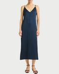 Navy slip dress worn by a model on a white background