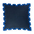 A square throw pillow in dark navy blue fabric with a contrasting bright blue jigsaw puzzle-edge border, shown on a plain white background.