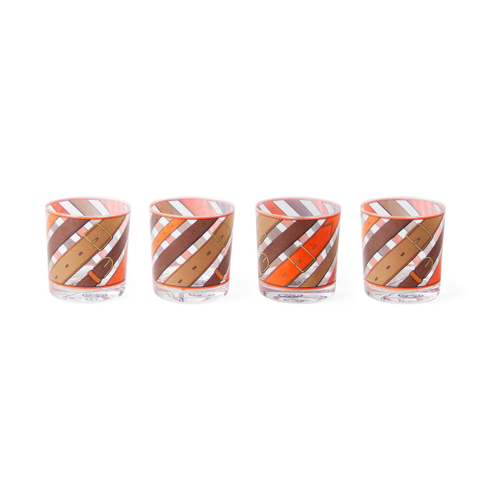 Four clear glass tumblers with a diagonal striped pattern in orange, brown, and white, arranged in a row on a white background.