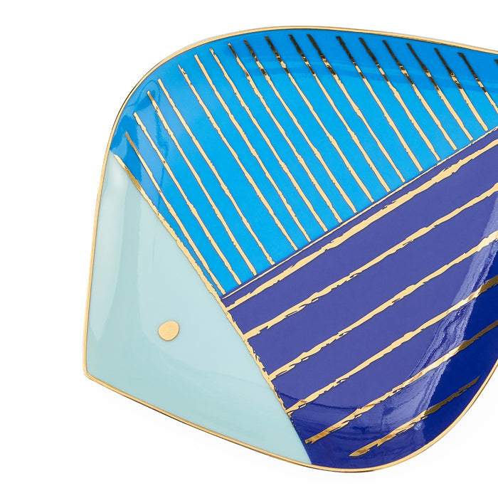 Decorative plate with blue and green design on a white background