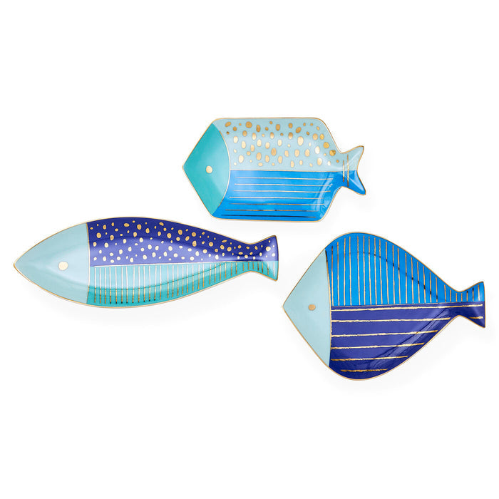 Three fish-shaped decorative plates with blue and gold patterns on a white background