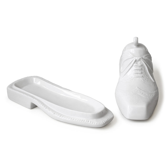 White ceramic shoe and slippers on a white background