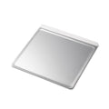 Angled view of Small Cookie Sheet showcasing raised rim and smooth baking surface on white background