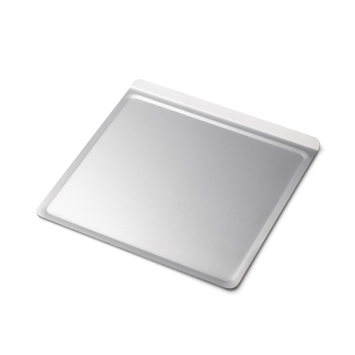 Angled view of Small Cookie Sheet showcasing raised rim and smooth baking surface on white background