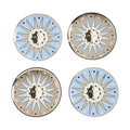 Four decorative plates with sun and moon designs on a white background
