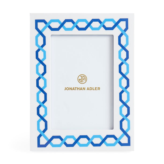 Decorative picture frame with blue geometric pattern and Jonathan Adler logo on a white background