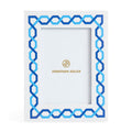 Decorative picture frame with blue geometric pattern and Jonathan Adler logo on a white background
