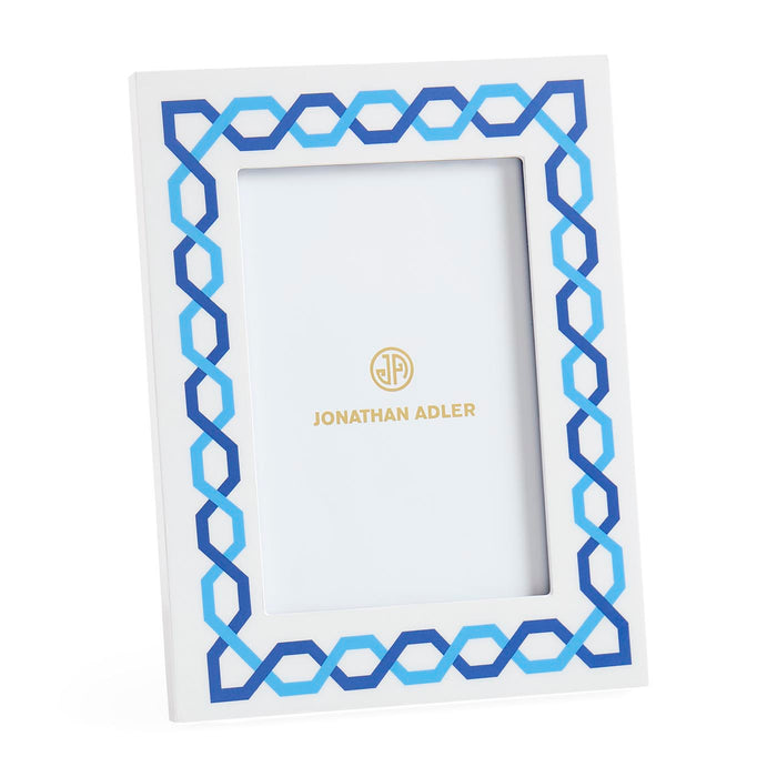 Decorative picture frame with blue and white geometric pattern on a white background, featuring the Jonathan Adler logo.