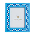 Blue decorative photo frame with Jonathan Adler logo on a white background