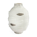 A white ceramic vase sculpted in the shape of a face with cutout eyes and mouth, featuring a dotted pattern on the neck and base, set against a plain white background.