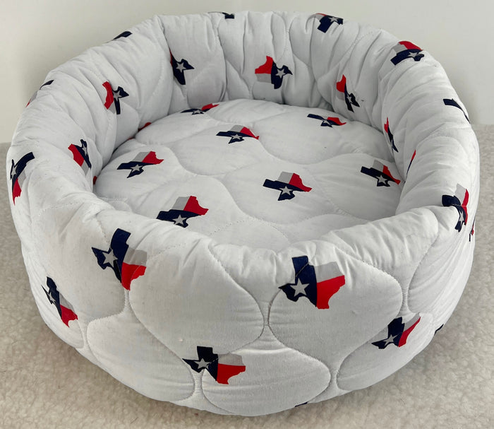 Soft cotton dog bed from fmsdogbeds, shaped like a donut with a cozy, plush interior for comfortable rest.