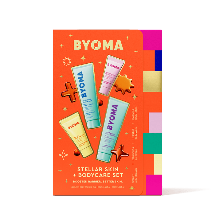 BYOMA body care set packaging on an orange background