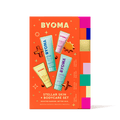 BYOMA body care set packaging on an orange background