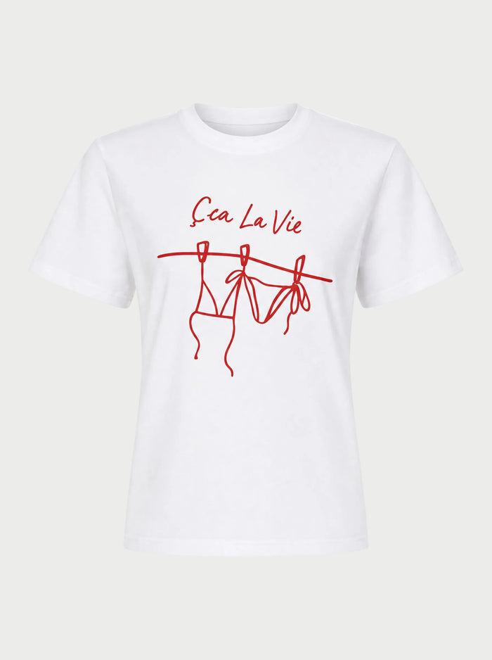 The Sunny Somewhere Sea La Vie Tee by Sunny Somewhere features red "Ça La Vie" text above a bikini line drawing on a white, lightweight crew neck tee with short sleeves and a relaxed fit—perfect for laid-back summer days.