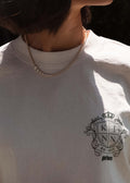 woman wearing a Kinn x Prince 14k Gold Naomi Graduated Diamond Tennis Necklace and The Standard Tee