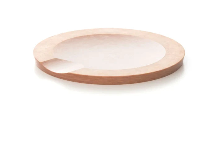 Natural round utensil rest made of wood, designed to keep counters clean.