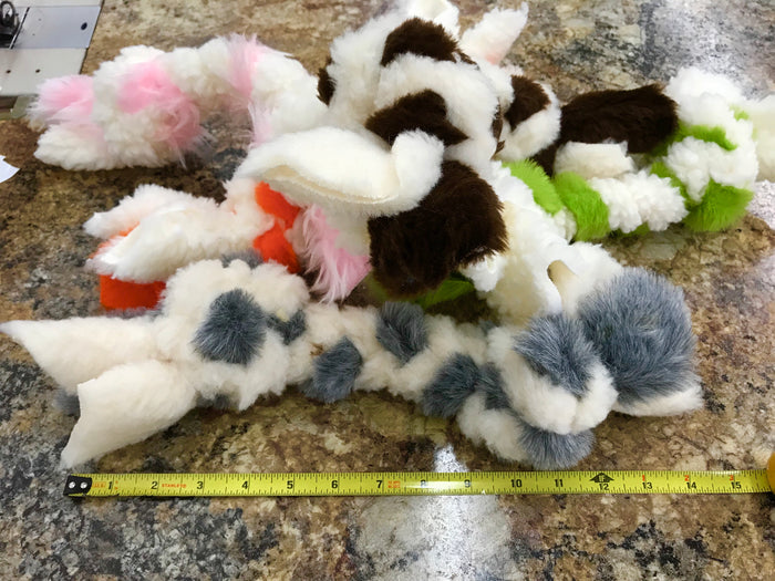 Small Fms Dog Beds toy, colorful and made of soft material, designed for dogs to chew and play with.