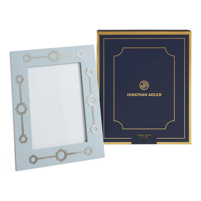 Two decorative picture frames with geometric designs on a white background