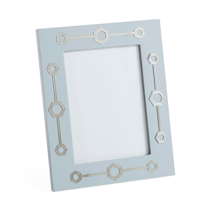 Light blue picture frame with geometric patterns on a white background