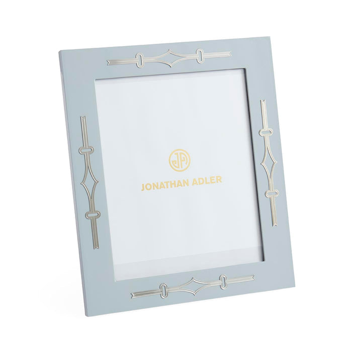 Light blue picture frame with decorative elements and 'Jonathan Adler' branding on a white background