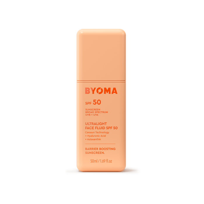 An orange bottle of BYOMA Ultralight Face Fluid SPF 50 sunscreen.