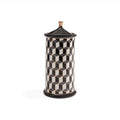 A cylindrical lidded container with a black and white 3D geometric cube pattern and a small gold-toned top knob, shown on a plain white background.