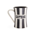 A ceramic mug with a black and white vertical striped design, featuring the word 'CAFFEINE' printed in bold black letters on a white band across the front. The mug has a white handle and a black interior, shown against a plain white background.
