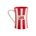 A ceramic mug with a red and white vertical striped design, featuring a white center panel with the word 'LOVE' in red. The mug has a curved handle and is photographed on a clean white background.