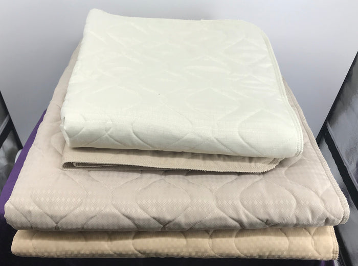 Fms Dog Beds water absorbent "Just In Case" pads on a dog bed, showing the soft, moisture-absorbing surface for pet comfort.