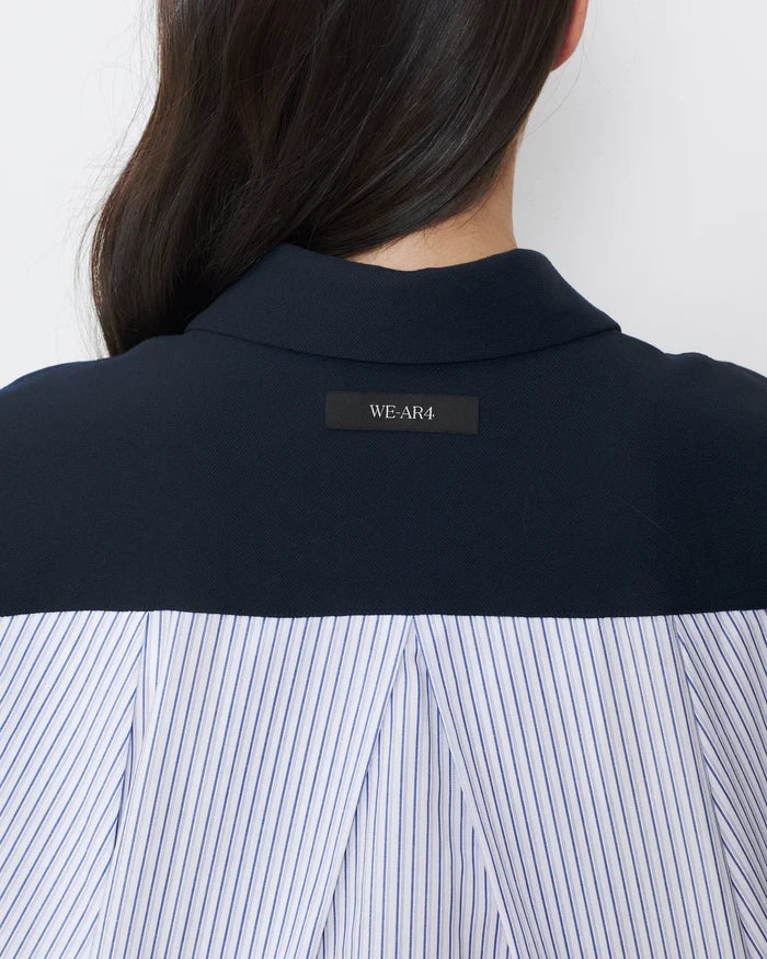 Navy shirt with a visible brand label on a white background