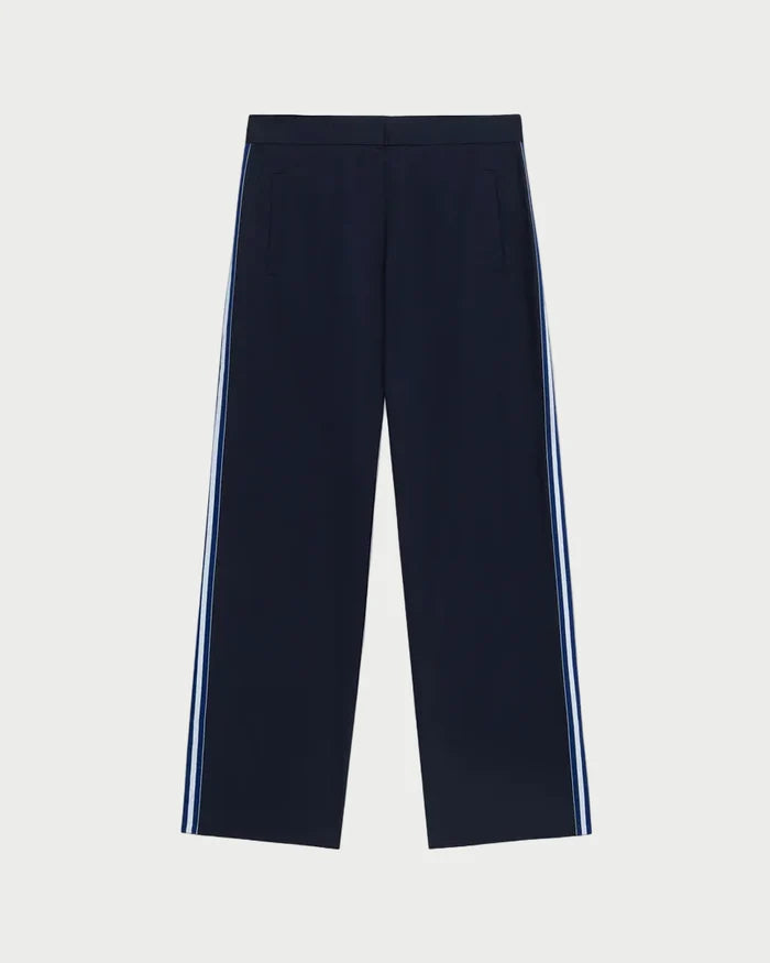 Navy pants with white stripes on a light gray background