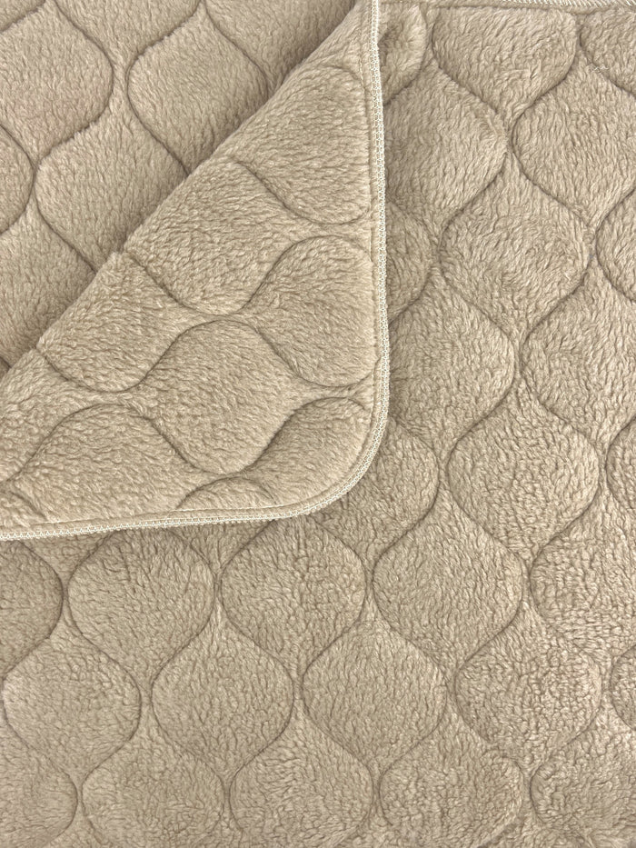 Fms Dog Beds almond whelping blanket on a soft dog bed, providing cozy comfort for puppies and mother dogs.